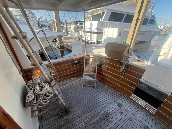 Anna Marie Yacht Photos Pics 1987 Kadey-Krogen 42 yacht deck with wooden flooring and marina view.