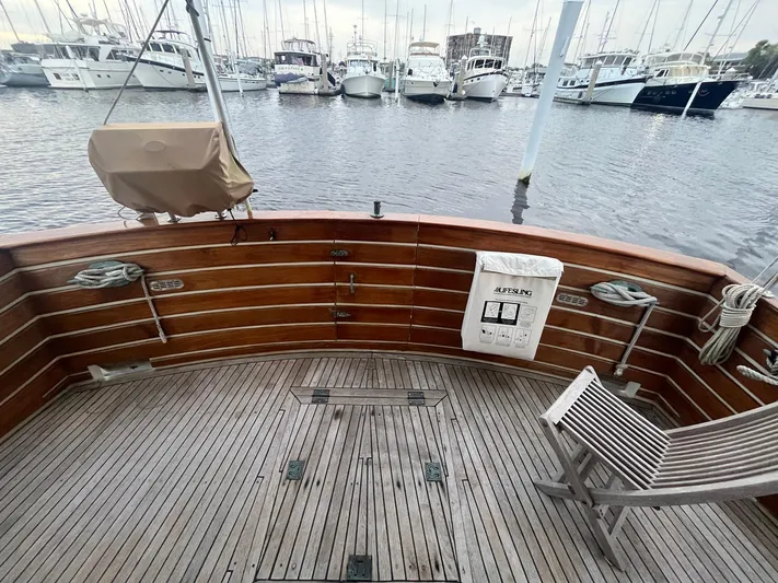 Anna Marie Yacht Photos Pics 1987 Kadey-Krogen 42 yacht deck with wooden finish, docked at marina.