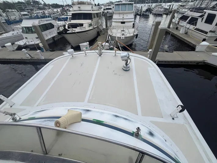 Anna Marie Yacht Photos Pics 1987 Kadey-Krogen 42 yacht docked at marina, surrounded by other boats.