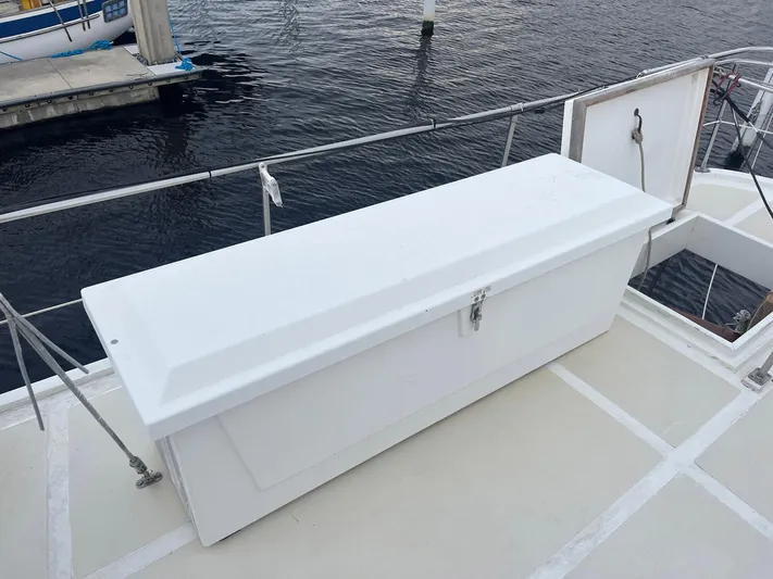 Anna Marie Yacht Photos Pics White storage box on 1987 Kadey-Krogen 42 boat deck by the water.