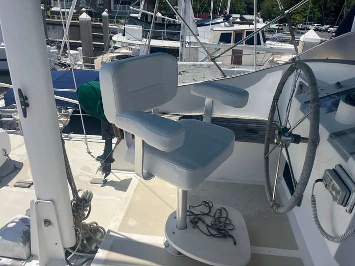 Anna Marie Yacht Photos Pics Captain's chair and steering wheel on 1987 Kadey-Krogen 42 yacht deck.