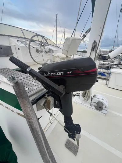 Anna Marie Yacht Photos Pics Johnson outboard motor on 1987 Kadey-Krogen 42 boat deck, with steering wheel visible.