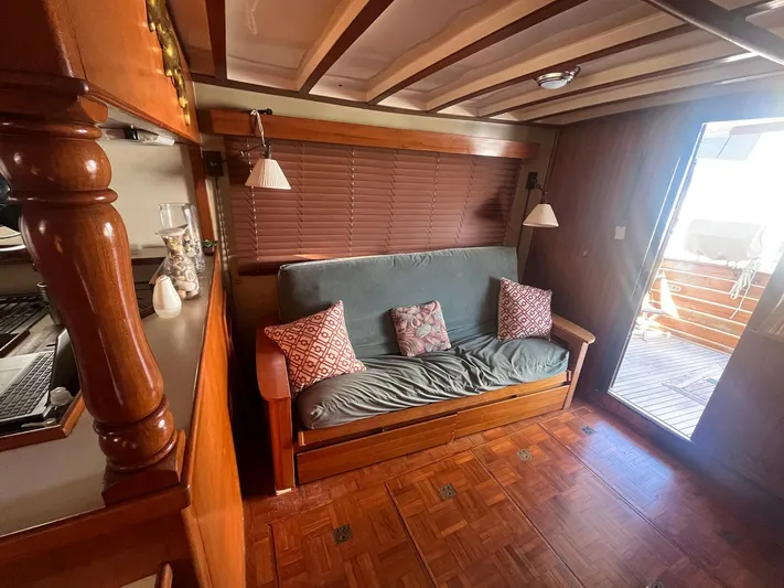 Anna Marie Yacht Photos Pics Cozy interior of 1987 Kadey-Krogen 42 yacht with wooden decor and comfortable seating.