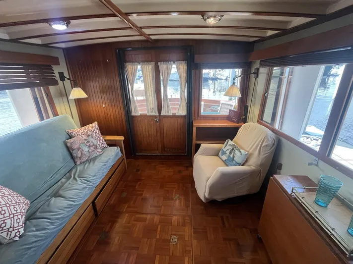 Anna Marie Yacht Photos Pics Interior of 1987 Kadey-Krogen 42 yacht with cozy seating and wooden decor.