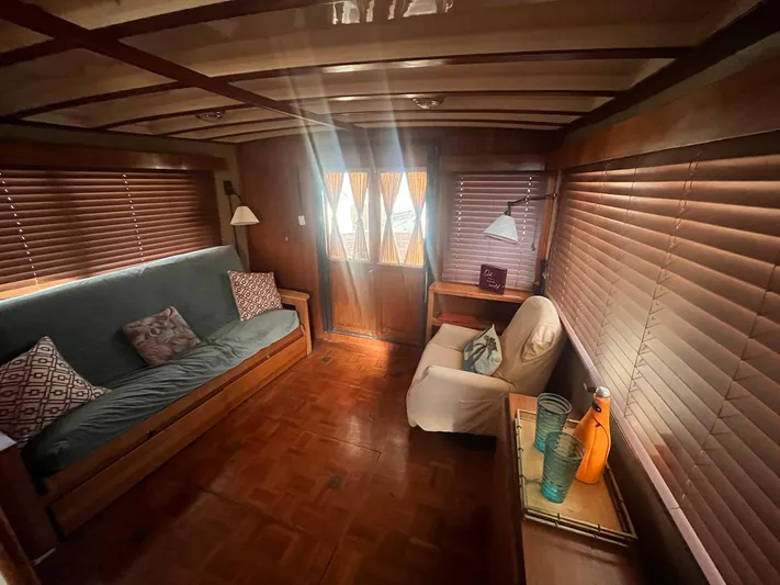 Anna Marie Yacht Photos Pics Cozy interior of 1987 Kadey-Krogen 42 yacht with wooden accents and comfortable seating.