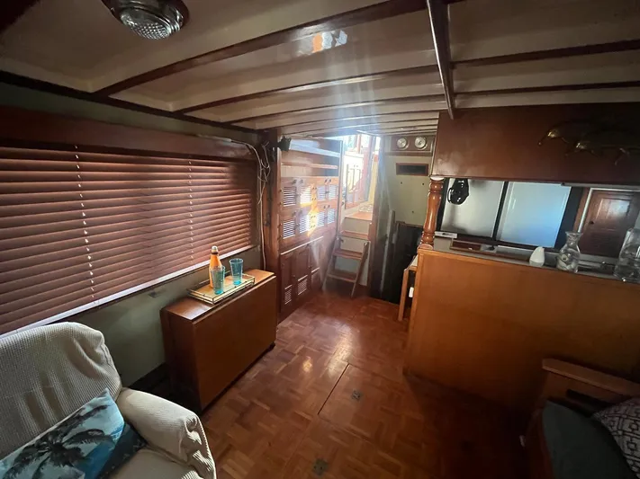 Anna Marie Yacht Photos Pics Cozy interior of a 1987 Kadey-Krogen 42 yacht with wooden furnishings and natural light.