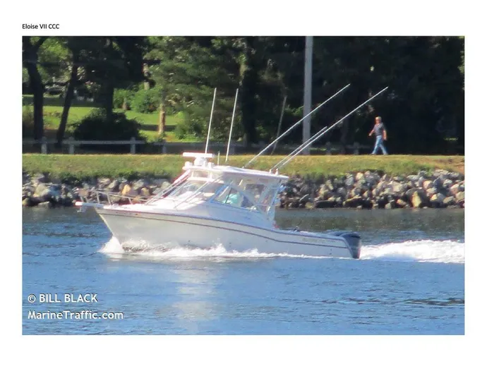  Yacht Photos Pics 2008 Grady-White Express 305 boat cruising on a river with trees in the background.