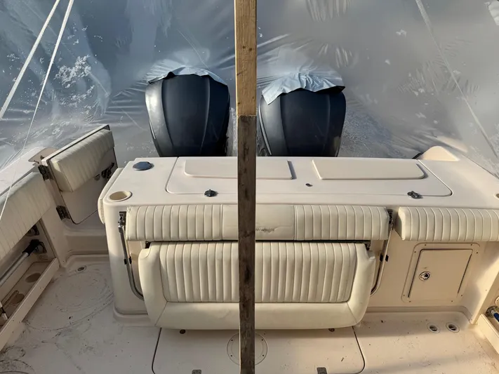  Yacht Photos Pics 2008 Grady-White Express 305 boat interior with twin engines, under protective cover.