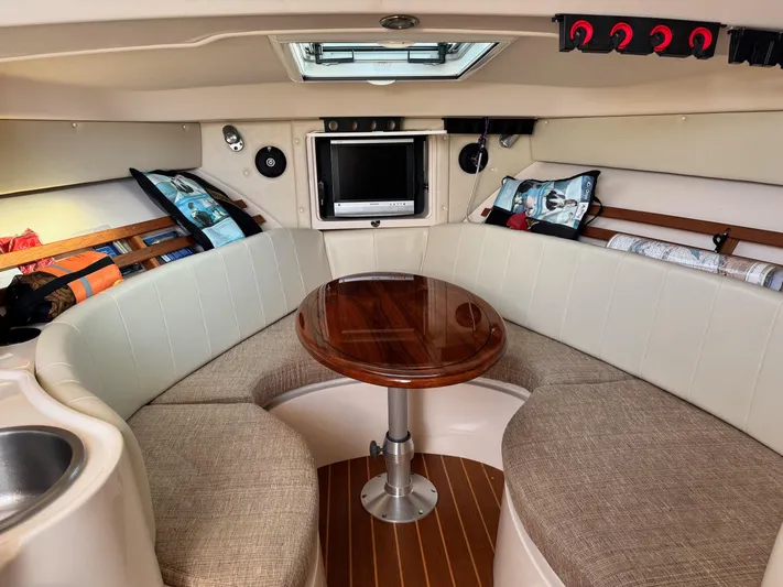  Yacht Photos Pics 2008 Grady-White Express 305 cabin interior with seating, table, and TV.