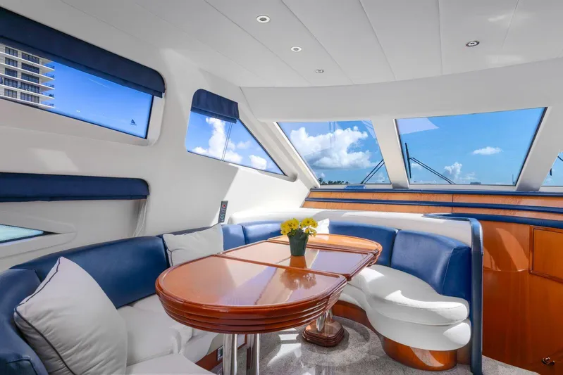  Yacht Photos Pics Luxurious interior of 2001 Azimut Sea Jet yacht with panoramic windows and elegant seating area.