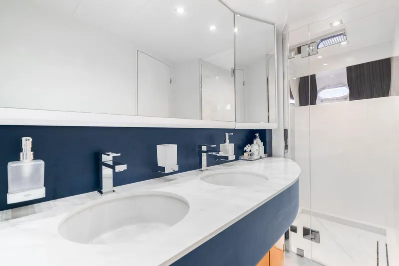  Yacht Photos Pics Luxurious bathroom in a 2001 Azimut Sea Jet yacht with dual sinks and modern fixtures.