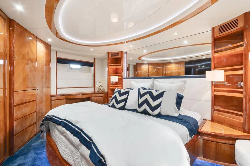  Yacht Photos Pics Luxurious bedroom interior of 2001 Azimut Sea Jet yacht with modern design and elegant wood finishes.