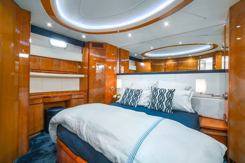  Yacht Photos Pics Luxurious bedroom interior of 2001 Azimut Sea Jet yacht with modern lighting and wooden finishes.