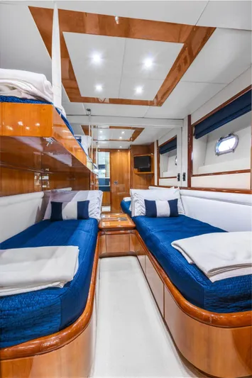  Yacht Photos Pics Luxurious cabin interior of 2001 Azimut Sea Jet yacht with twin beds and modern amenities.