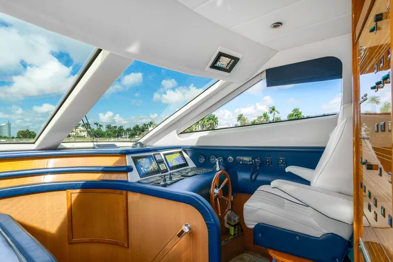  Yacht Photos Pics Interior helm of 2001 Azimut Sea Jet yacht with panoramic windows and modern controls.