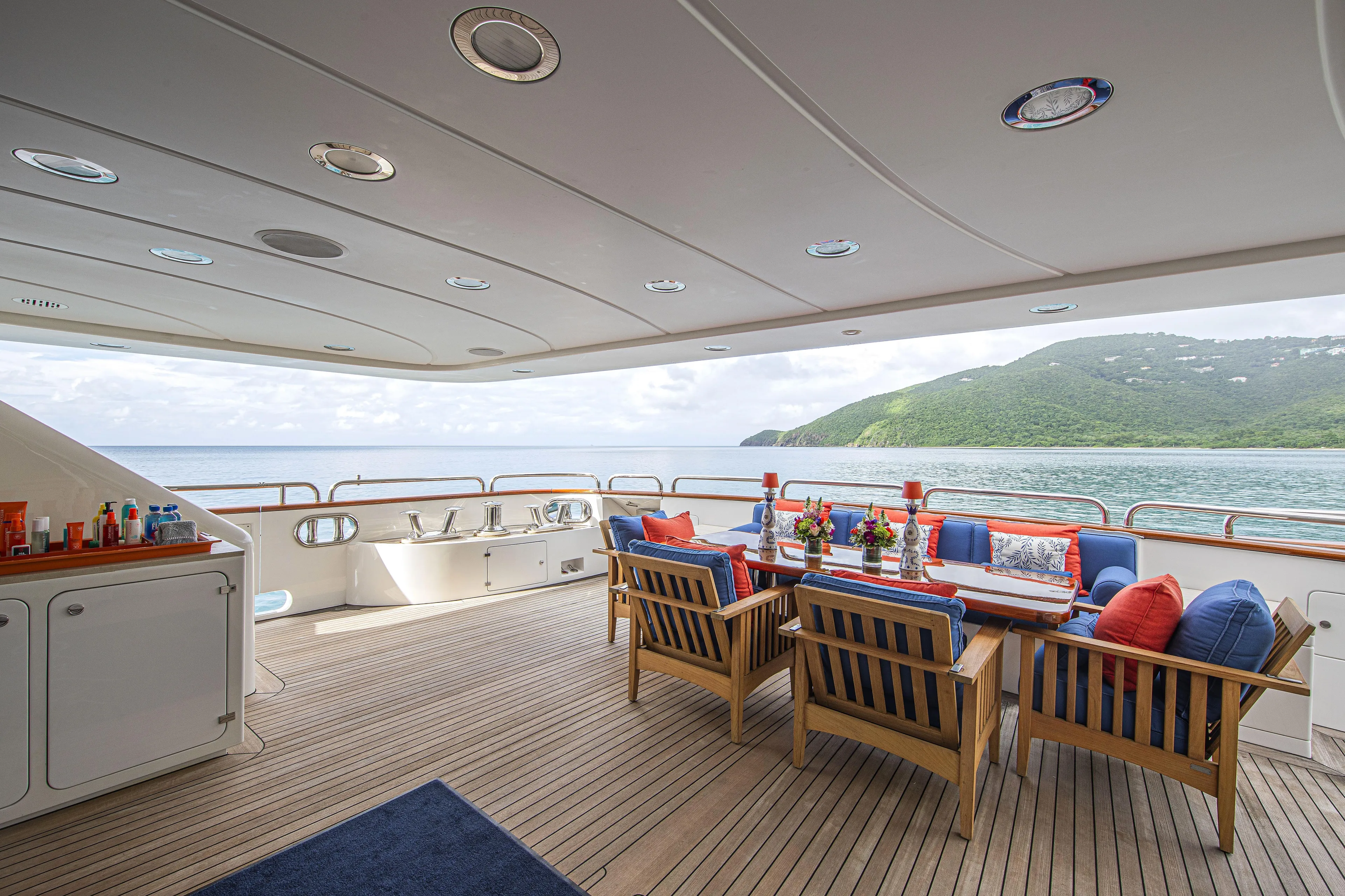 Sur La Mer Yacht Photos Pics Luxurious Benetti Vision 145 yacht deck with dining area, ocean view, and elegant seating, 2011 model.