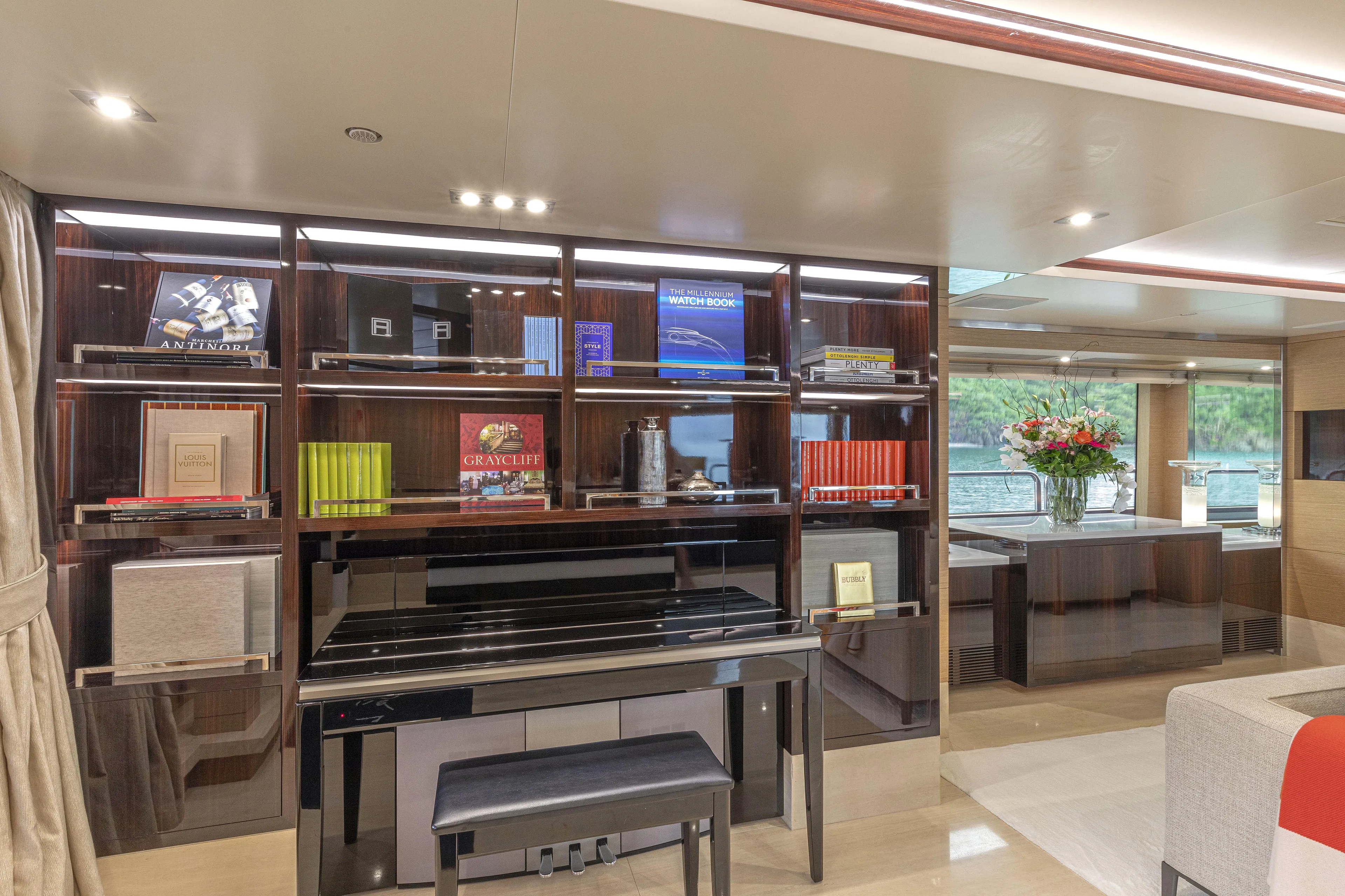 Sur La Mer Yacht Photos Pics Luxurious interior of 2011 Benetti Vision 145 yacht with elegant bookshelf and piano.