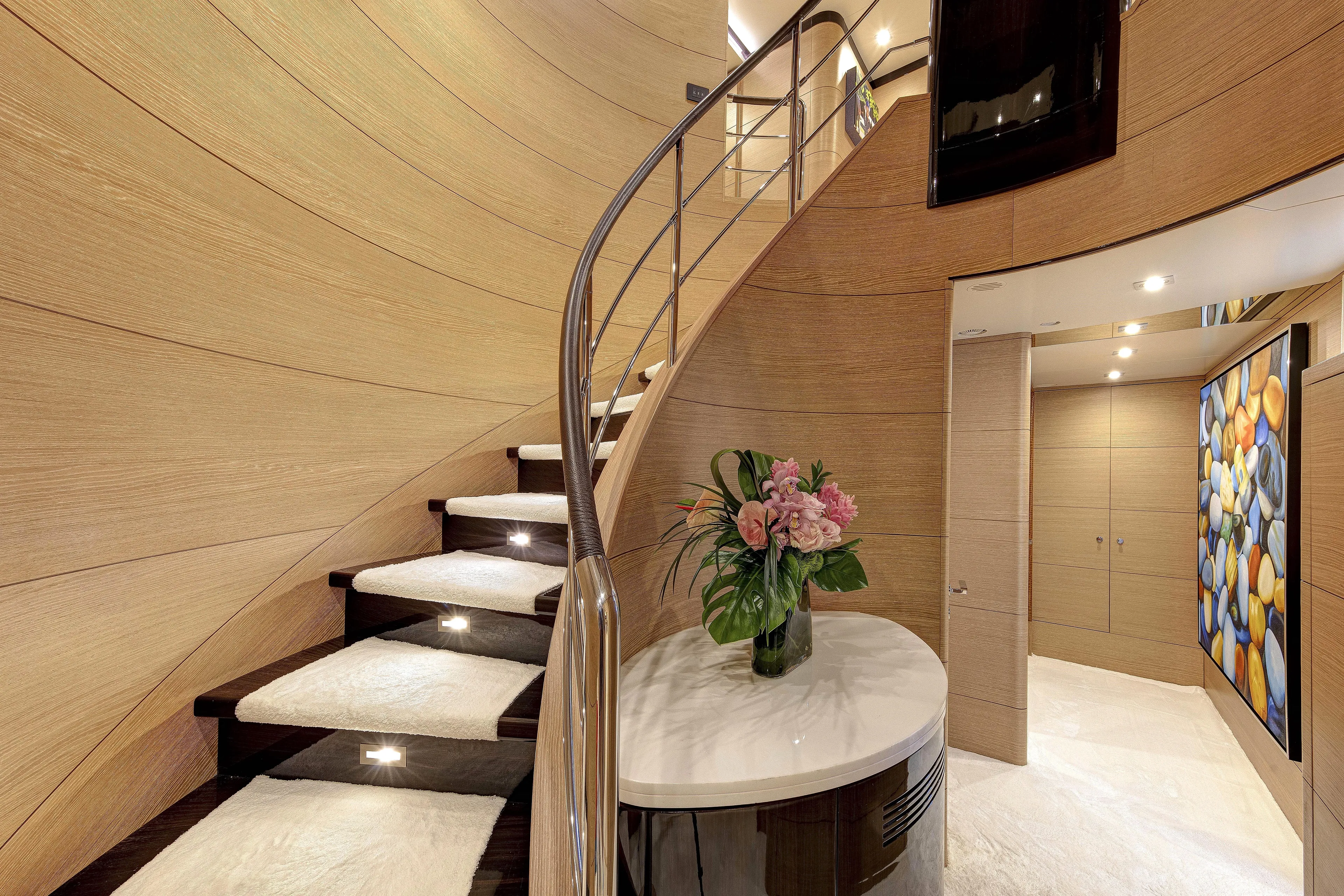 Sur La Mer Yacht Photos Pics Luxurious interior of 2011 Benetti Vision 145 yacht with elegant staircase and modern decor.