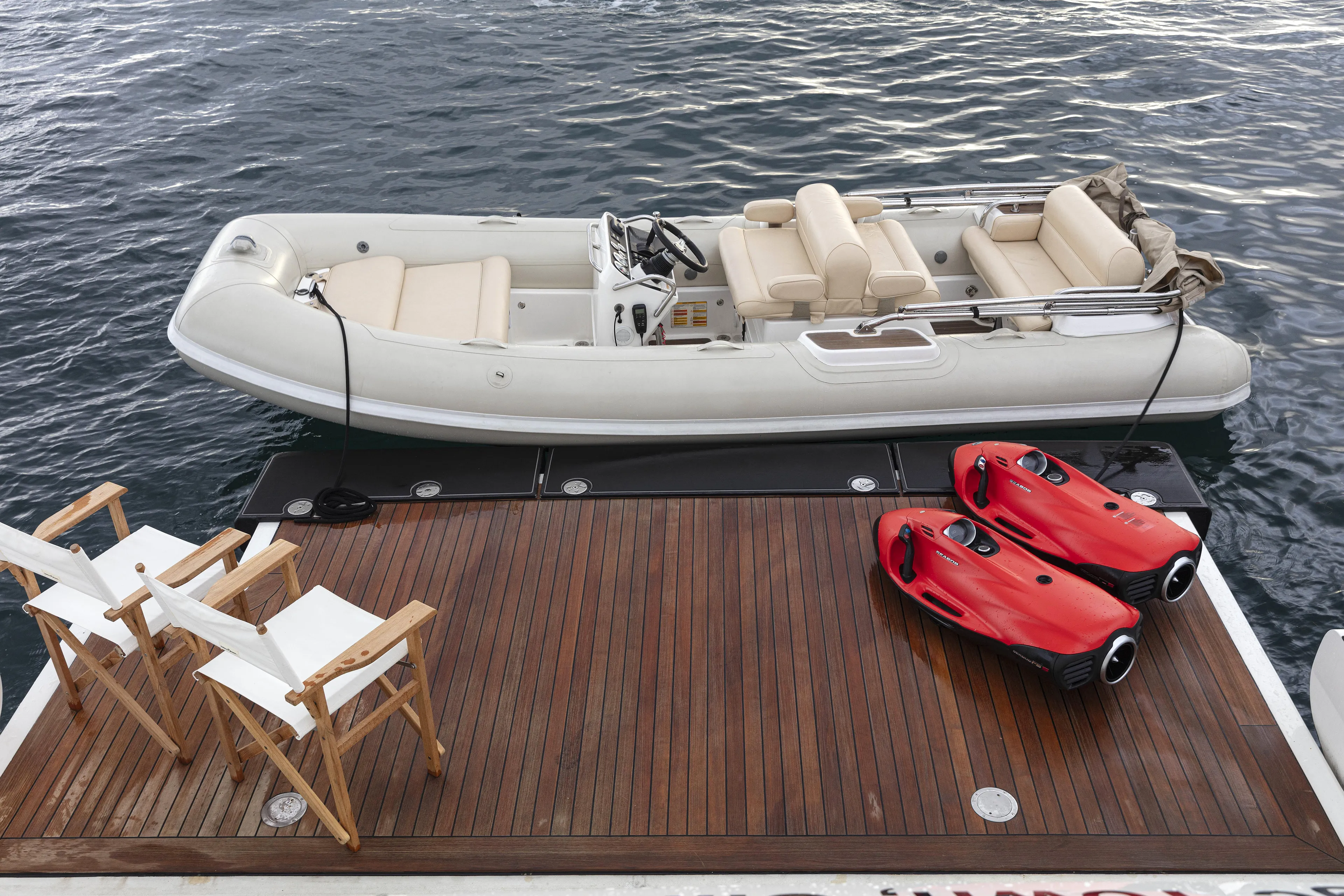 Sur La Mer Yacht Photos Pics Luxury yacht deck with tender boat and red sea scooters, Benetti Vision 145, 2011 model.