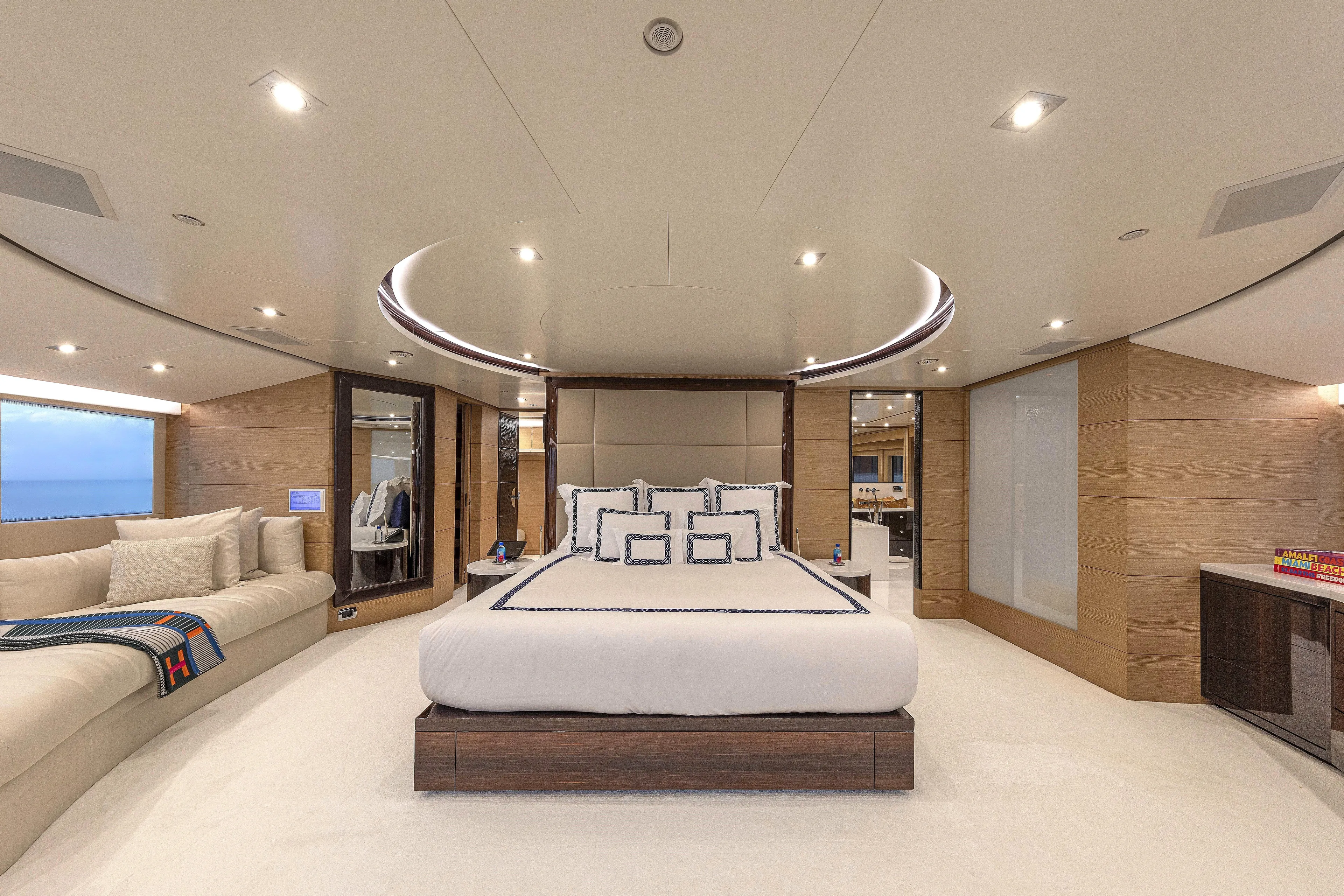 Sur La Mer Yacht Photos Pics Luxurious bedroom interior on 2011 Benetti Vision 145 yacht, featuring elegant design and modern amenities.