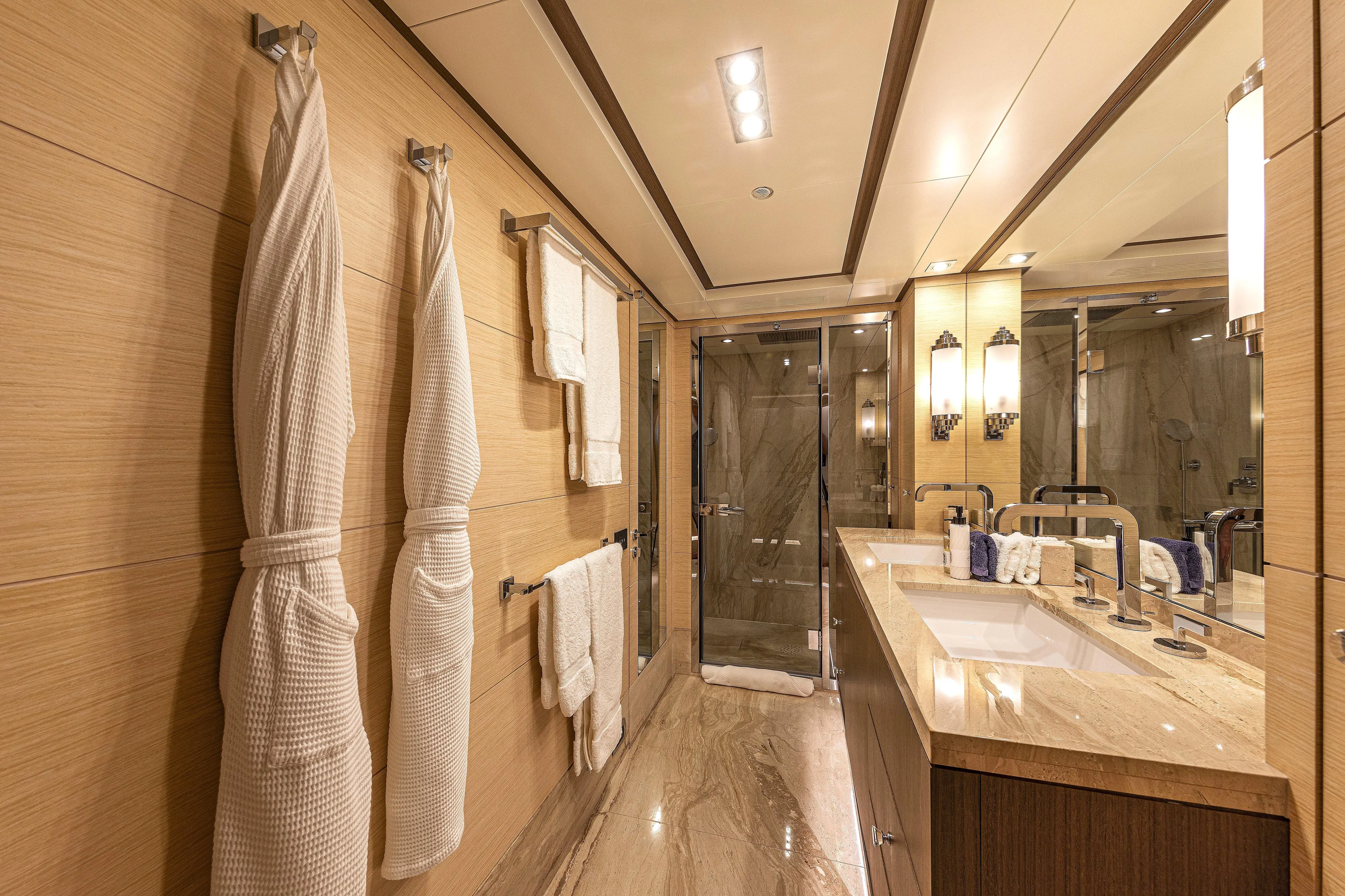 Sur La Mer Yacht Photos Pics Luxurious bathroom on 2011 Benetti Vision 145 yacht with elegant fixtures and plush robes.