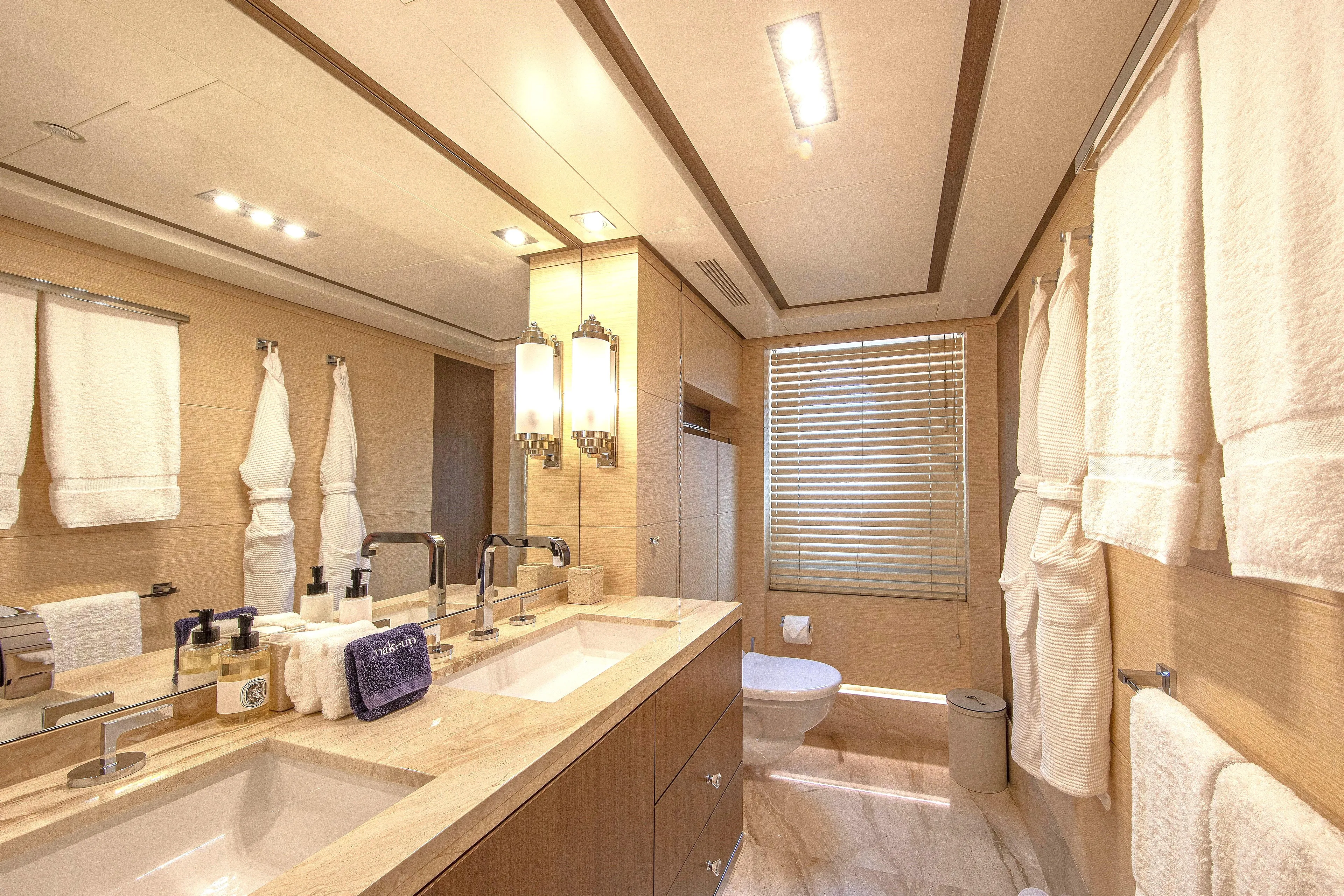 Sur La Mer Yacht Photos Pics Luxurious bathroom in 2011 Benetti Vision 145 yacht with double sinks and elegant lighting.