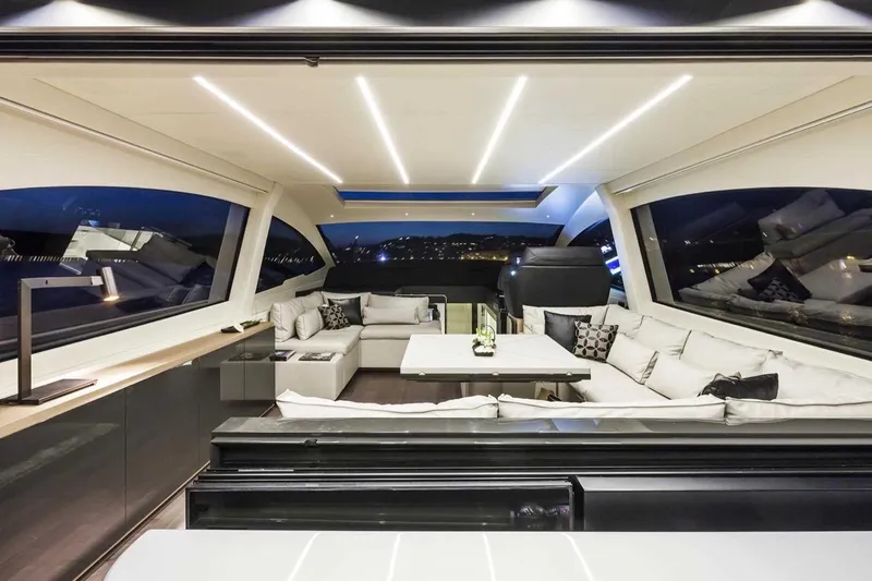  Yacht Photos Pics Luxurious interior of 2018 Pershing 7X yacht with modern seating and ambient lighting.