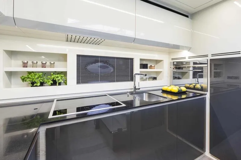  Yacht Photos Pics Modern kitchen interior on 2018 Pershing 7X yacht with sleek design and stainless steel appliances.