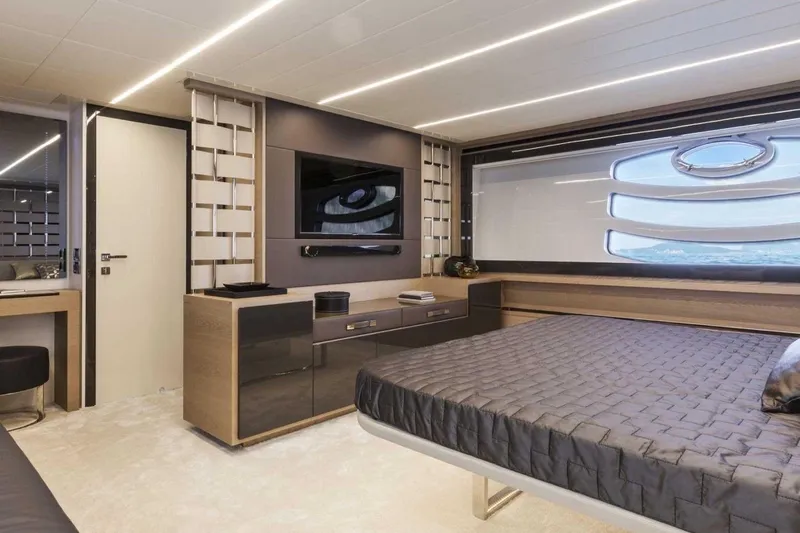  Yacht Photos Pics Luxurious bedroom interior of 2018 Pershing 7X yacht with modern design and large window.