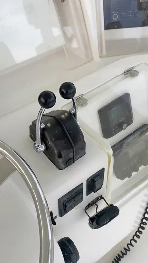  Yacht Photos Pics 2004 Bertram 51 Convertible boat control panel with throttle and navigation instruments.