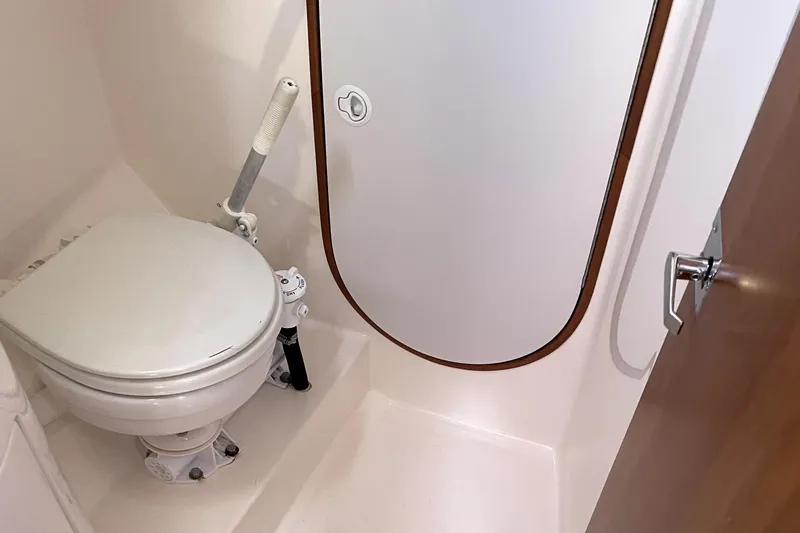 "legacy" Yacht Photos Pics 2006 J Boats J/109 yacht bathroom with marine toilet and compact design.