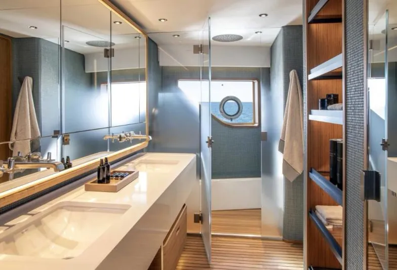  Yacht Photos Pics Luxurious bathroom in 2023 Custom Line Navetta 30 yacht with modern fixtures and elegant design.