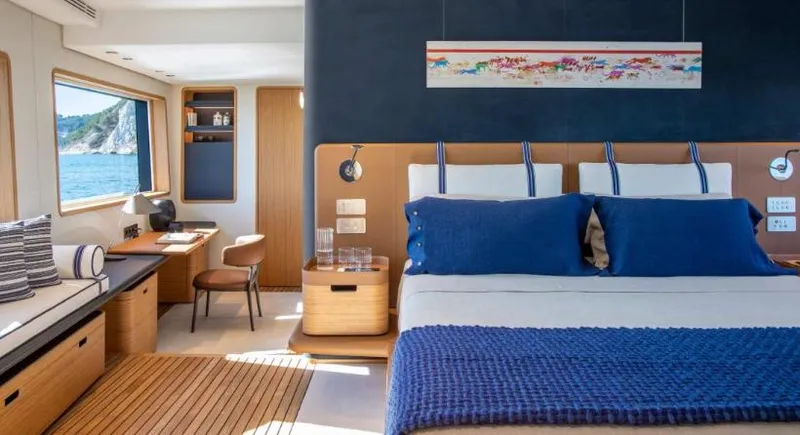  Yacht Photos Pics Luxurious 2023 Custom Line Navetta 30 yacht bedroom with ocean view and elegant decor.