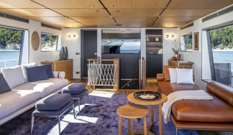  Yacht Photos Pics Luxurious interior of 2023 Custom Line Navetta 30 yacht with modern furnishings and scenic ocean view.