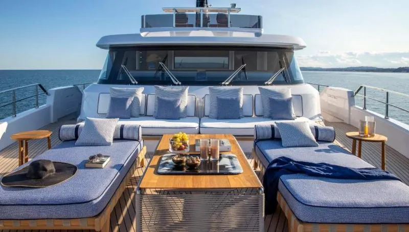  Yacht Photos Pics Luxurious 2023 Custom Line Navetta 30 yacht deck with plush seating and ocean view.