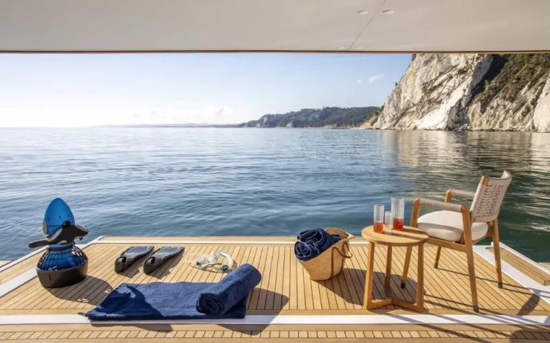  Yacht Photos Pics Luxurious 2023 Custom Line Navetta 30 yacht deck with ocean view and relaxation setup.