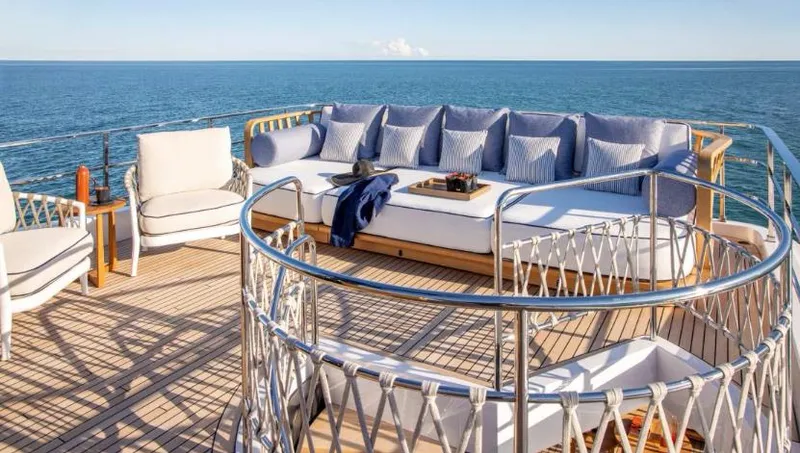  Yacht Photos Pics Luxurious 2023 Custom Line Navetta 30 yacht deck with elegant seating and ocean view.