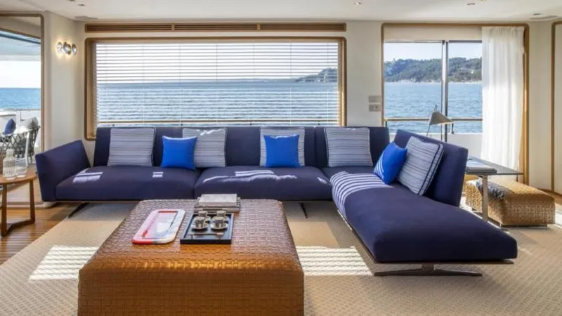  Yacht Photos Pics Luxurious 2023 Custom Line Navetta 30 yacht interior with ocean view, featuring elegant blue seating.