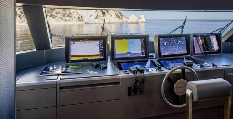  Yacht Photos Pics Control panel of 2023 Custom Line Navetta 30 yacht with navigation screens.