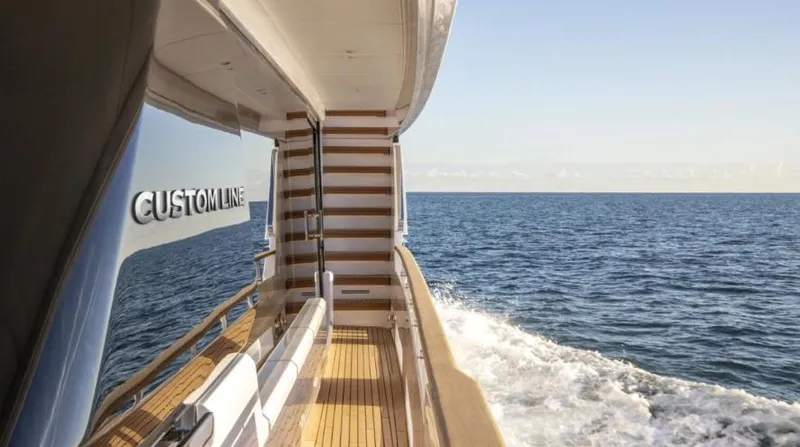  Yacht Photos Pics 2023 Custom Line Navetta 30 yacht cruising on open sea, showcasing elegant deck design.