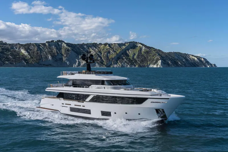  Yacht Photos Pics Luxury yacht Custom Line Navetta 30 cruising near scenic cliffs, 2023 model.