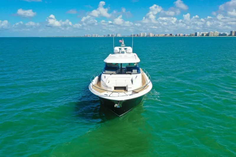 Tranquil Moments II Yacht Photos Pics 2023 Tiara Yachts EX 60 cruising on clear blue ocean waters.