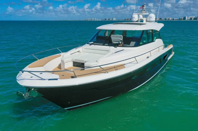 Tranquil Moments II Yacht Photos Pics 2023 Tiara Yachts EX 60 luxury yacht cruising on clear blue waters.