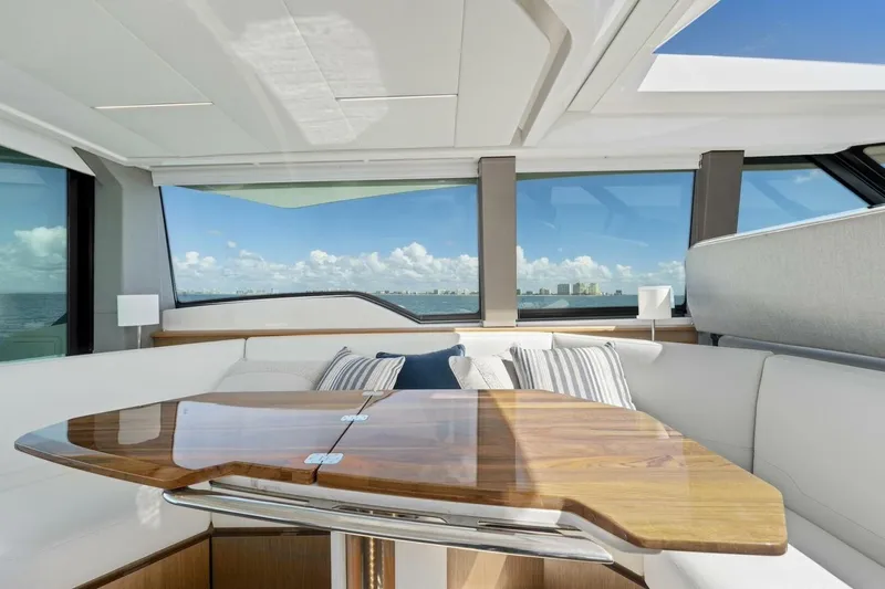 Tranquil Moments II Yacht Photos Pics Luxurious interior of 2023 Tiara Yachts EX 60 with elegant seating and ocean view.