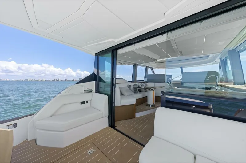 Tranquil Moments II Yacht Photos Pics 2023 Tiara Yachts EX 60 interior with luxurious seating and ocean view.