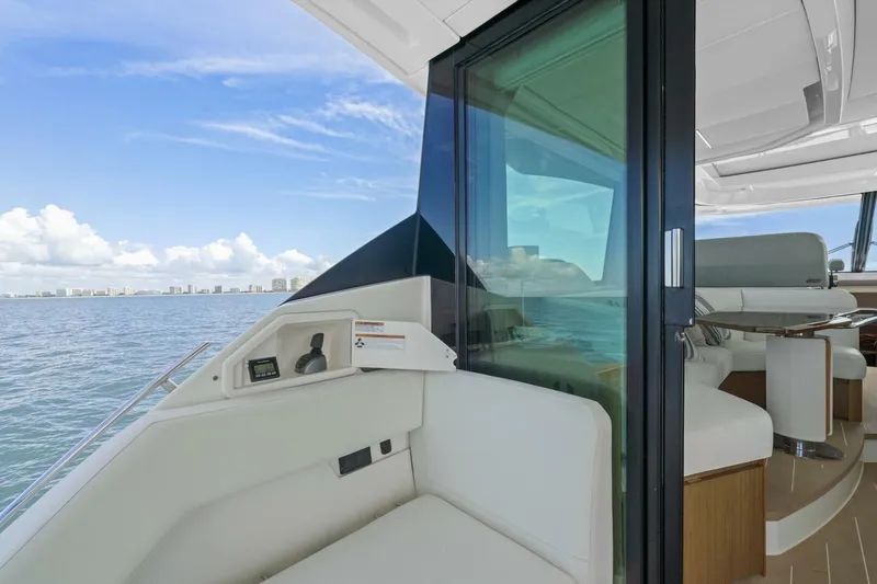 Tranquil Moments II Yacht Photos Pics 2023 Tiara Yachts EX 60 interior with ocean view and modern seating.