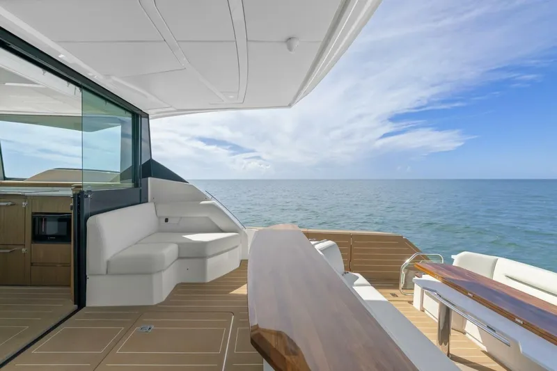 Tranquil Moments II Yacht Photos Pics 2023 Tiara Yachts EX 60 luxury yacht interior with ocean view and elegant seating.