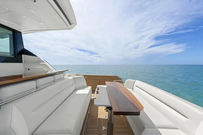 Tranquil Moments II Yacht Photos Pics Luxurious 2023 Tiara Yachts EX 60 with elegant seating and ocean view.