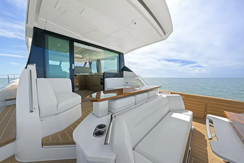 Tranquil Moments II Yacht Photos Pics 2023 Tiara Yachts EX 60 luxury yacht interior with ocean view, featuring elegant seating and modern design.