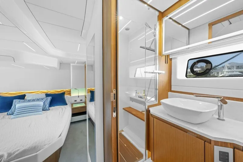 Tranquil Moments II Yacht Photos Pics Luxurious 2023 Tiara Yachts EX 60 interior with modern bedroom and bathroom design.
